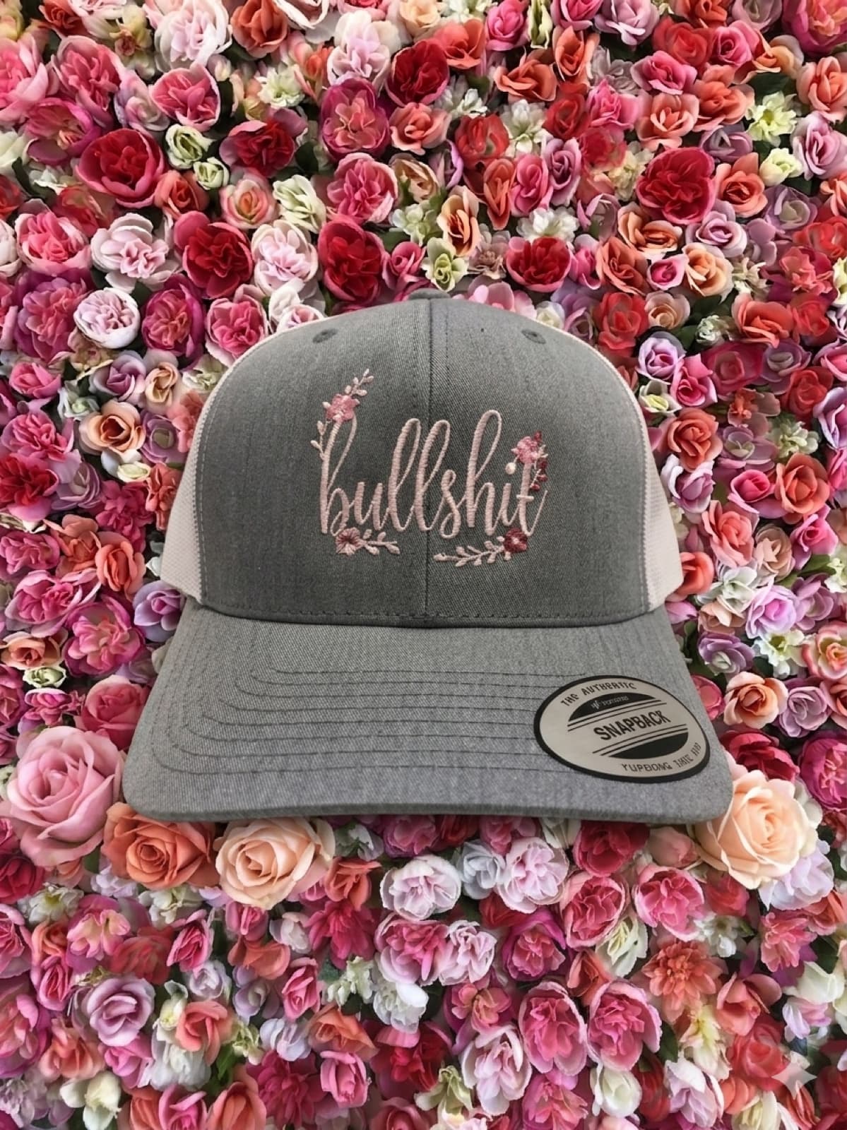 Gray Bullshit Hat on floral background