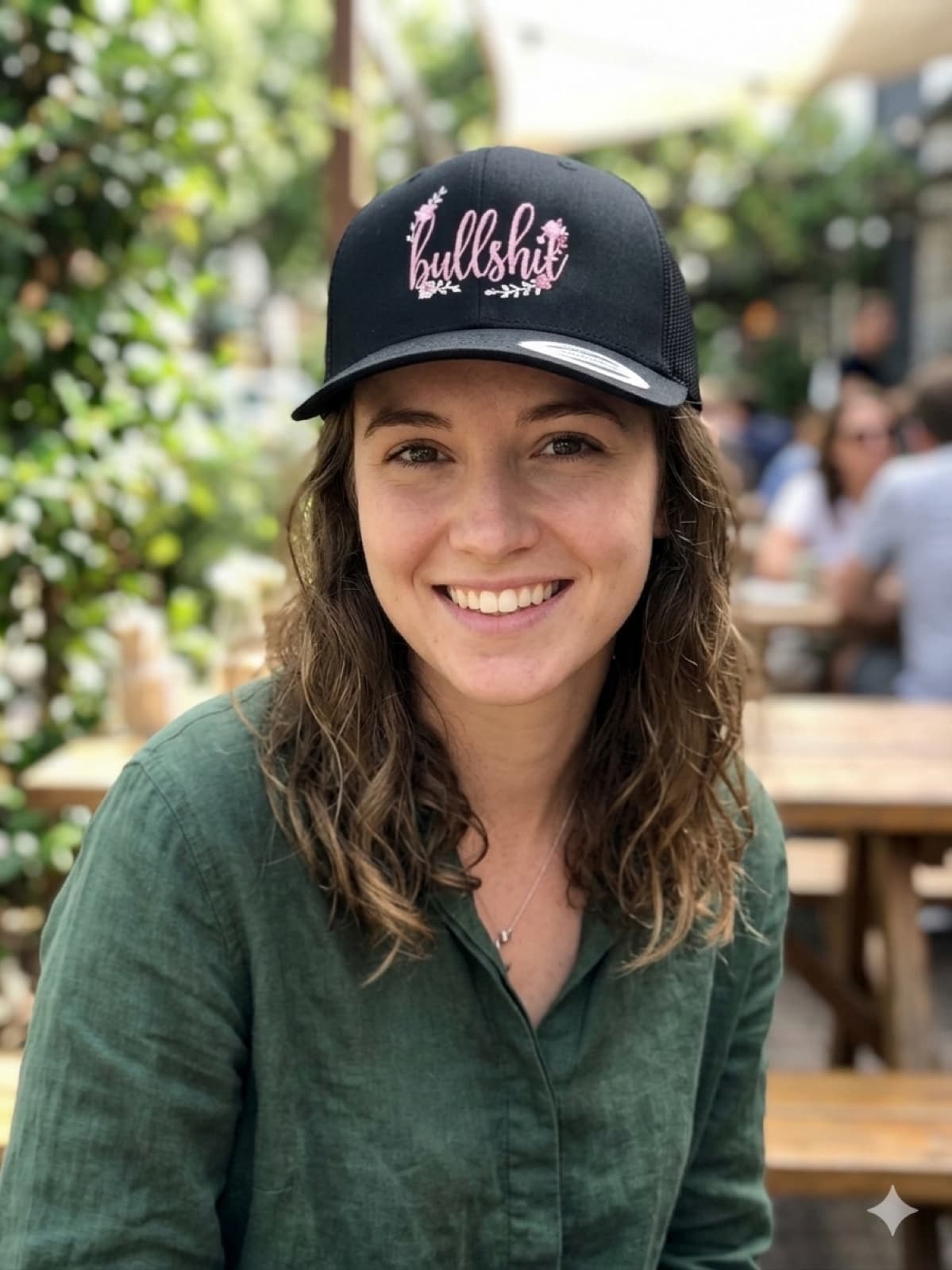 Black Bullshit Hat model photo at a cafe