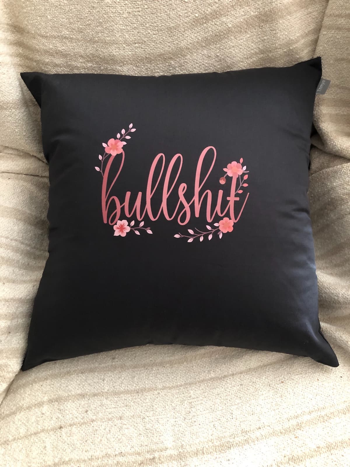 Black Bullshit Pillow on couch